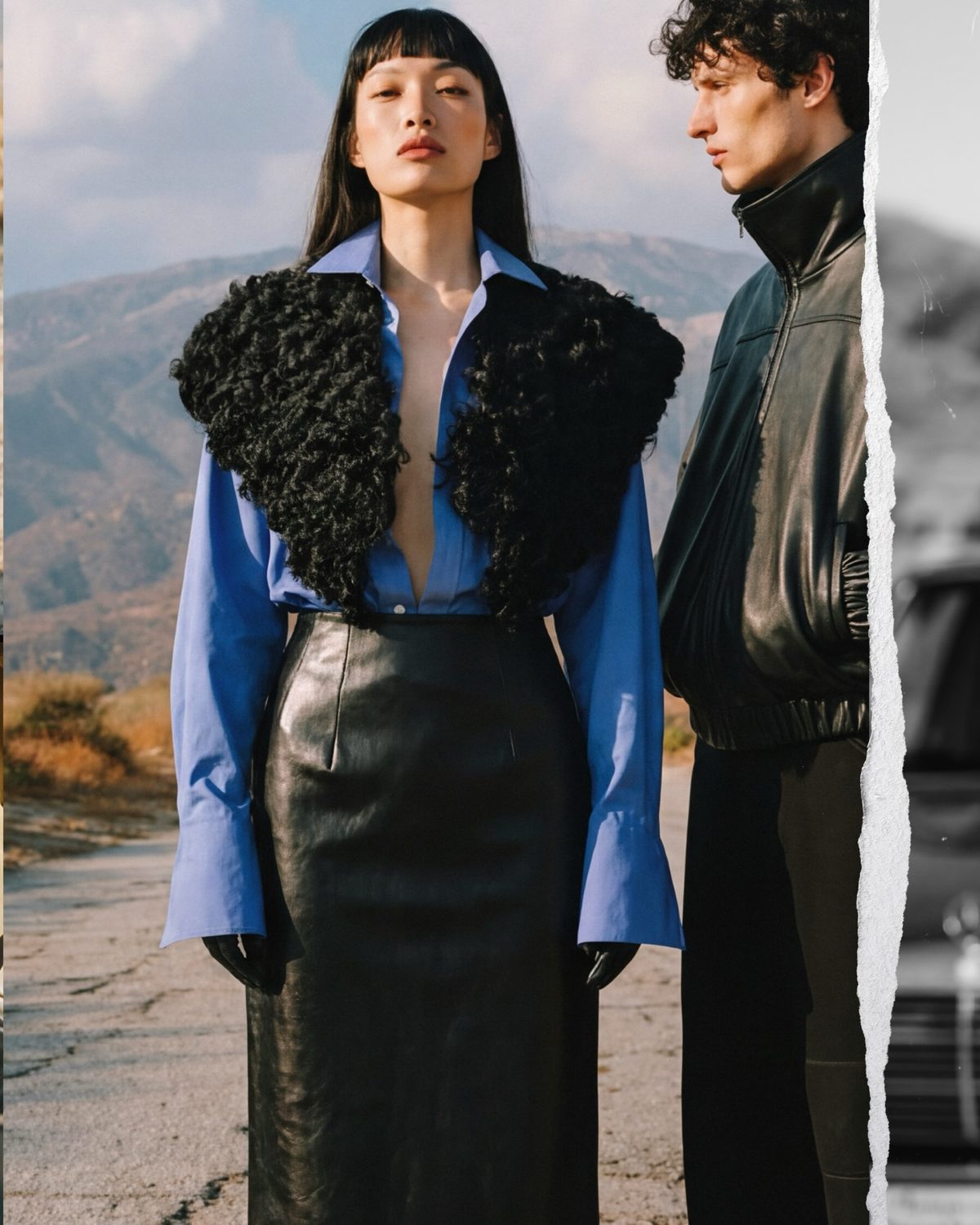AI-generated on-model e-commerce visual — sculptural blue-grey outfit in a desert setting
